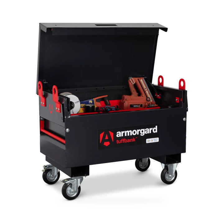 Armorgard TuffBank TB2 Site Box — with optional castors, lifting eyes and shelf; tools shown for illustration. Optional castors, crane lifting eyes and shelf shown; tools are illustrative and not included.